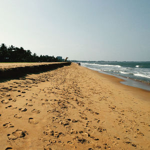 Scenic view of beach against clear sky