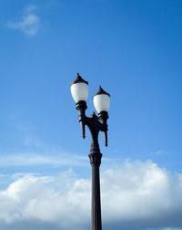 Low angle view of street light against sky