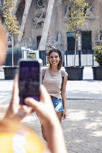 Portrait of woman photographing