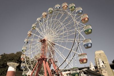 Low angle view of ferris wheel against sky