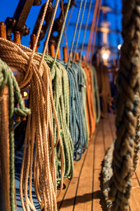 Close-up of rope tied up on wood