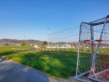 View of soccer field against clear sky