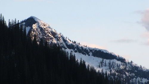 Scenic view of snowcapped mountains against clear sky