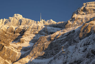 Scenic view of snowcapped mountains against clear sky