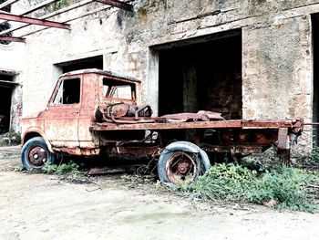 Old motor scooter parked on road