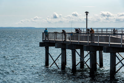 Pier on sea against sky