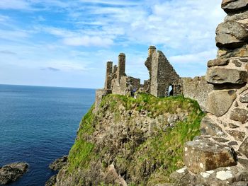 Castle by sea against sky