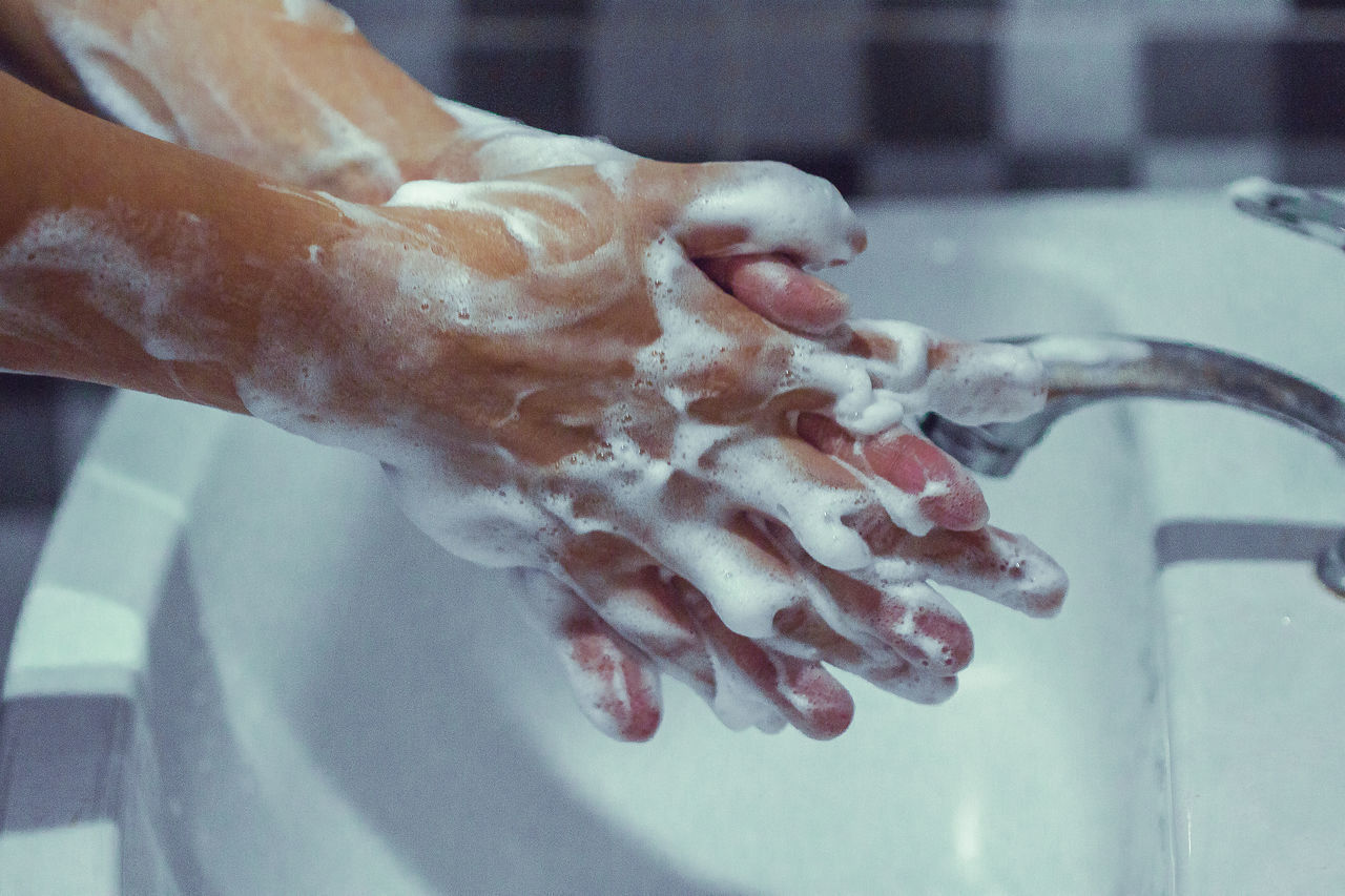 CLOSE-UP OF HUMAN HAND WITH TEXT