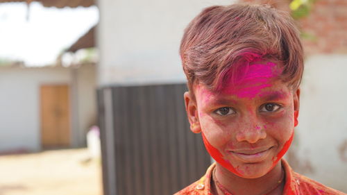 Little boy plays with colors.concept for indian festival holi.