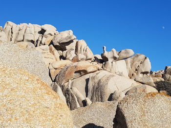 Moon valley - low angle view of rock formation against clear blue sky