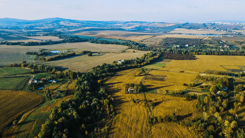 Flight over the fields behind the western ukrainian village aerial view