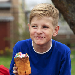 Smiling boy having dessert