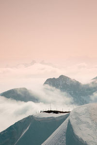 Scenic view of snow covered mountains against sky