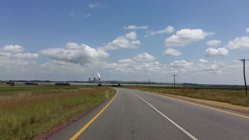 Empty road passing through landscape