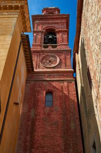 Low angle view of clock tower in city