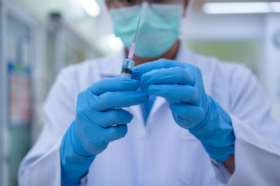 Midsection of hands working