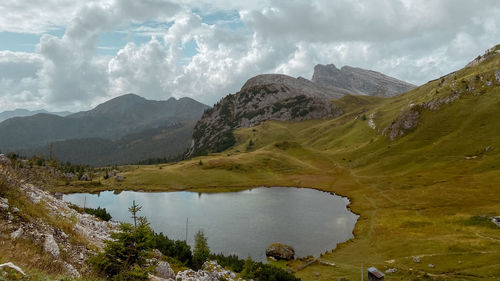 Scenic view of lake and mountains against sky