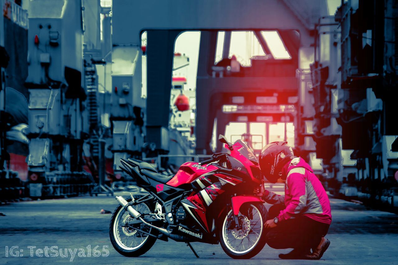 MAN CYCLING ON CITY