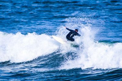 Surfer catching a wave 