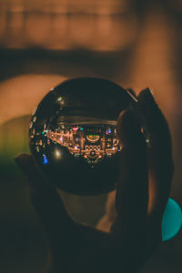 Close-up of person photographing illuminated smart phone
