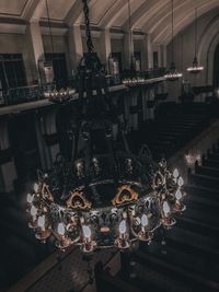 Low angle view of illuminated chandelier in building