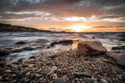 Scenic view of sea against sky during sunset