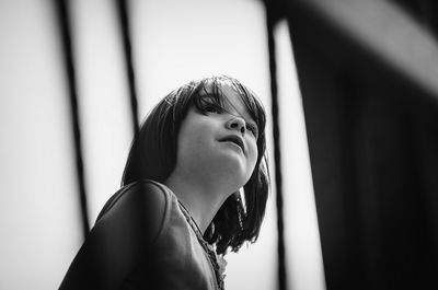 Low angle view of girl looking away