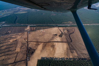 High angle view of agricultural landscape seen through airplane