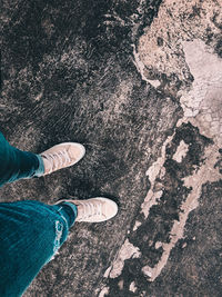 Low section of person standing on street