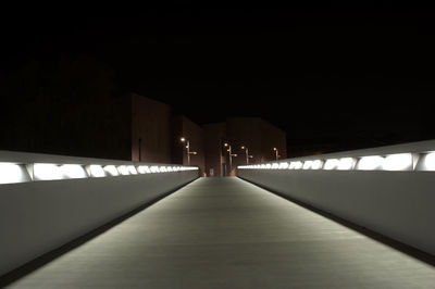 Empty walkway at night