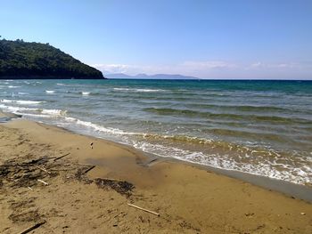 Scenic view of beach against sky