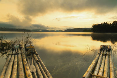 Scenic view of lake against sky during sunset