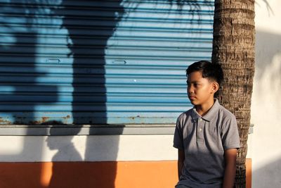 Boy standing outdoors
