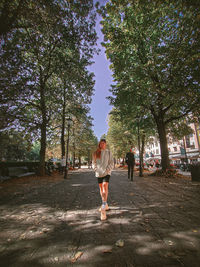 Rear view of woman walking on street