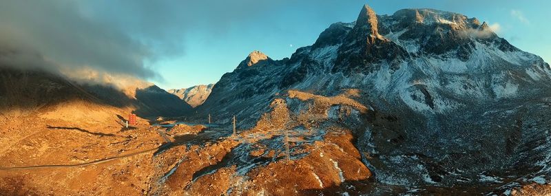 Panoramic view of rock formations against sky