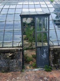 Abandoned building seen through glass window