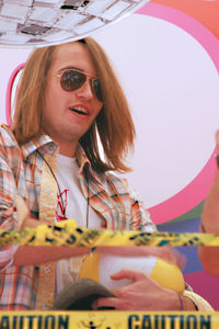 Portrait of young woman wearing sunglasses