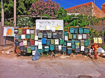 Public mailboxes on fence by footpath