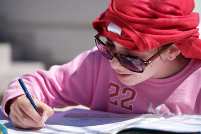 Midsection of man reading book on table
