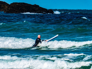 Man surfing in sea