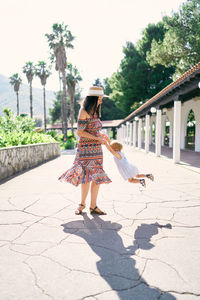 Woman walking on footpath