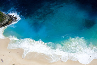 High angle view of waves on beach