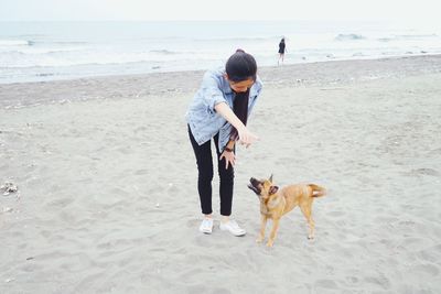 Woman standing on beach