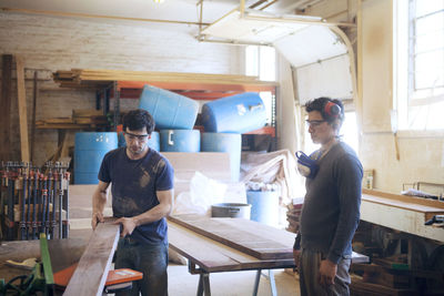 Male carpenters working in workshop