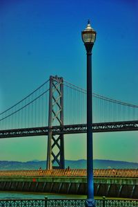 Low angle view of street light against clear blue sky