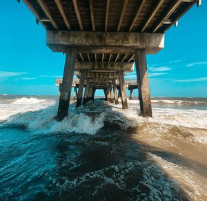 View of pier over sea against sky