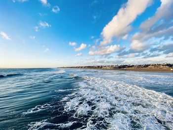 Scenic view of sea against blue sky