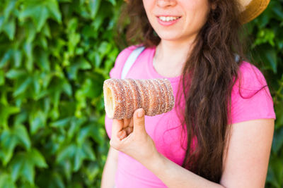 Midsection of woman holding ice cream