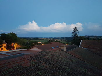 High angle view of houses and buildings against sky