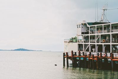 Ship on lake against sky